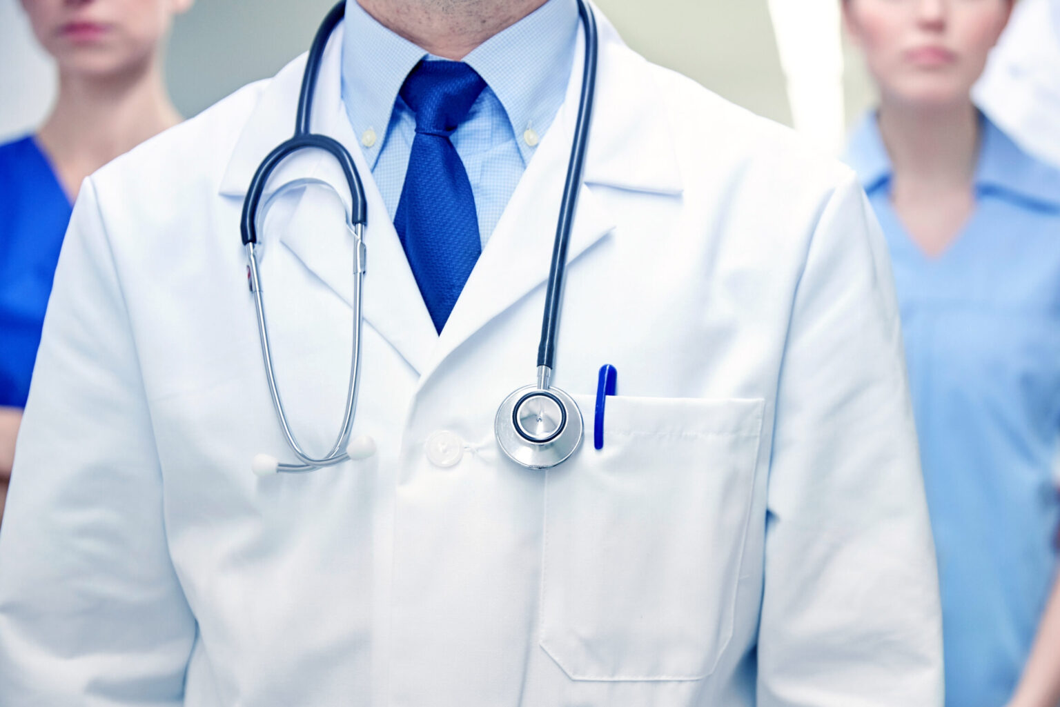 close up of medics or doctors at hospital